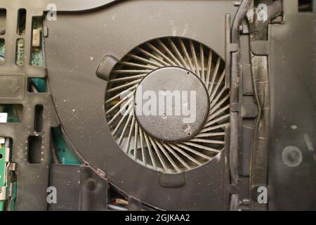 Dusty laptop fan dirty cluttered computer electronics internals Stock Photo