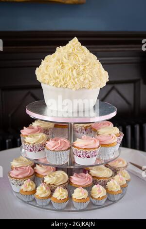 Cupcakes on a stand in the shape of a big cake for a Wedding reception Stock Photo