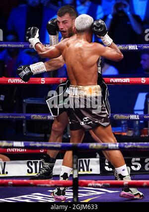 Sam Eggington (left) in action against Bilel Jkitou in the World Boxing Council Silver Middle Title during the boxing event at the Coventry Skydome Arena. Picture date: Friday September 10, 2021. Stock Photo