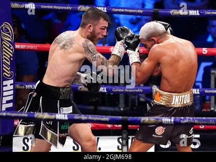 Sam Eggington (left) in action against Bilel Jkitou in the World Boxing Council Silver Middle Title during the boxing event at the Coventry Skydome Arena. Picture date: Friday September 10, 2021. Stock Photo