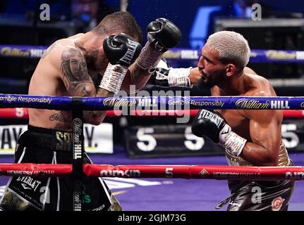 Sam Eggington (left) in action against Bilel Jkitou in the World Boxing Council Silver Middle Title during the boxing event at the Coventry Skydome Arena. Picture date: Friday September 10, 2021. Stock Photo