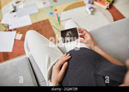Focus on ultrasound scan image, baby sonography in the hand of a smiling  pregnant woman, isolated on white background 23730150 Stock Photo at  Vecteezy