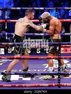 Sam Eggington (left) in action against Bilel Jkitou in the World Boxing Council Silver Middle Title during the boxing event at the Coventry Skydome Arena. Picture date: Friday September 10, 2021. Stock Photo