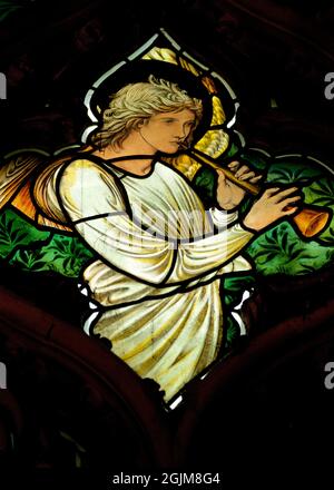 Detail of musical angel in the tracery of the St Catherine stained glass window by Edward Burne Jones in the Cathedral of Christ Church College, University of Oxford, Oxford, England, UK Stock Photo