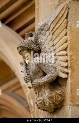 Stone carved angel  on the exterior of Magdalen College, University of Oxford, Oxford, England, UK Stock Photo