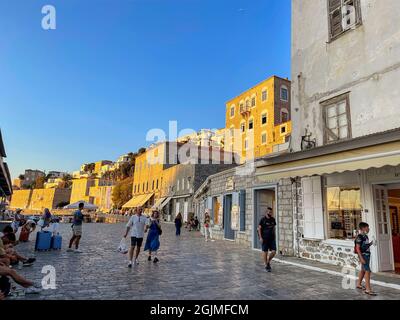 Beautiful sunset colors from the picturesque Hydra island in Greece. View from hydra town over the port. Stock Photo