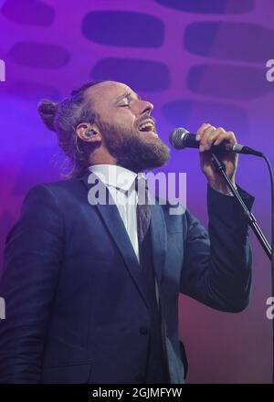 Winchester, UK. 10th Sep, 2021. Vocalist, Jonathan Scratchley performs live on stage with British dubstep band, Gentleman's Dub Club at Mucky Weekender Festival. Credit: SOPA Images Limited/Alamy Live News Stock Photo