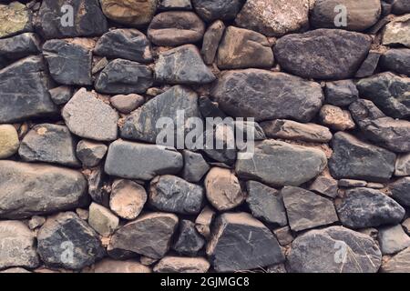 Natural stone wall. Full frame texture. Stock Photo