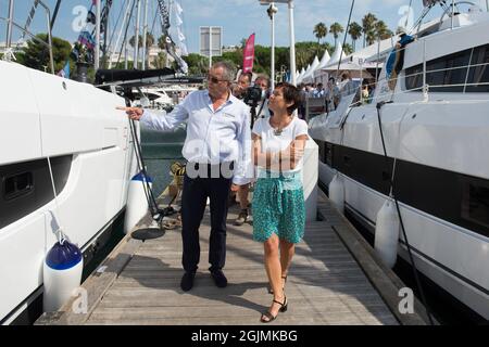 Annick Girardin and other members are seen walking and observing the boats during the festival.Annick Girardin (minister of the sea) inaugurated and visited the Cannes Yachting Festival. Canceled in 2020 because of the Coronavirus pandemic, it is the biggest 'boat show' in Europe. More than 560 new boats will be exhibited, of which nearly 150 will be world premieres. For the first time, a 'green' course is set up following the obligation voted by law to reserve 1% of the places in port for electric boats in French ports. Stock Photo