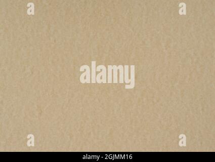 Pavlova colour paper background. Mottled beige paper texture. Stock Photo
