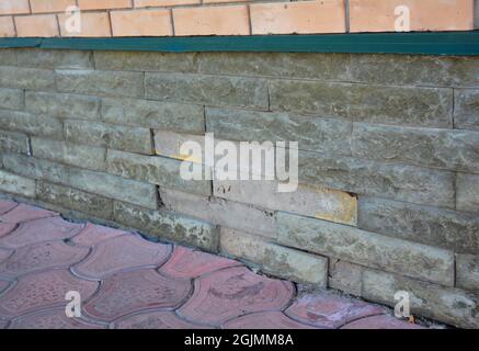 Foundation Repair - Warning Signs. House foundation repair. Foundation Repair. Broken Foundation House Brick Wall. Stock Photo