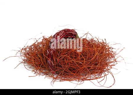 Chilli threads and chilli pod against white background Stock Photo