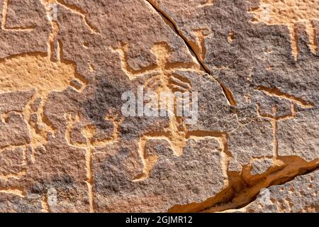 A petroglyphic image of humans with anatomical details, Graffiti Rocks (Qaryat al Asba), Musayqirah, Riyadh Province, Saudi Arabia Stock Photo