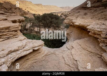 The eroded canyon bed right above the main pool at Sha'ib Luha near Riyadh Stock Photo