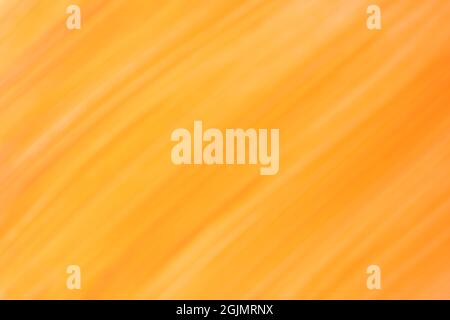 Blurred dark yellow and orange background with lines pattern. Defocused art abstract golden gradient backdrop with blur and bokeh. Blurry amber wallpa Stock Photo