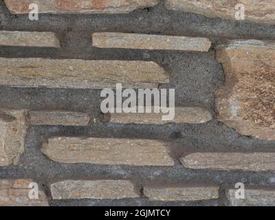 rustic wall made with rough stone bricks Stock Photo