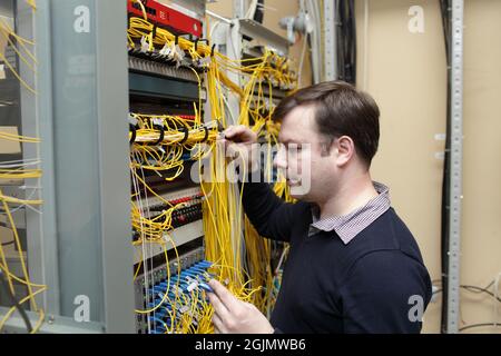 The network engineer jumpering fibre optic on optical distribution frame Stock Photo