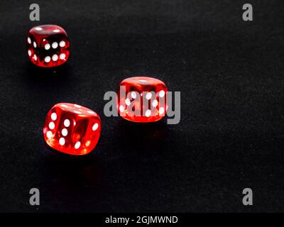 red transparent dice on black background Stock Photo