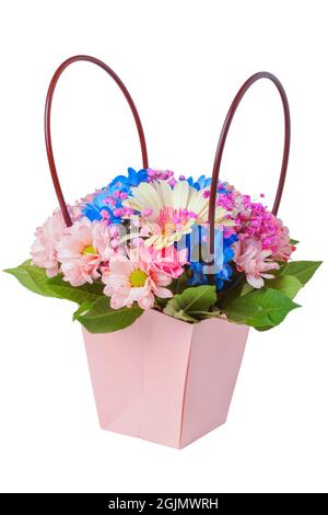 Basket with colorful flowers close up isolated on white Stock Photo