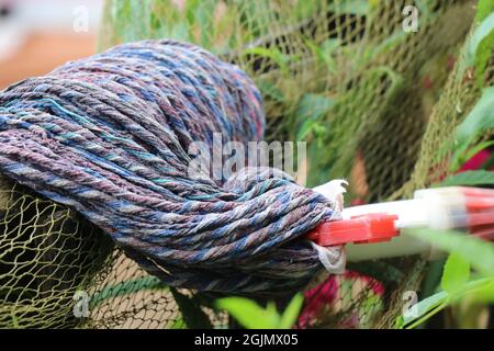 An old mop for cleaning floors, used house cleaning equipment kept for sundry, domestic dirt cleaning mop Stock Photo