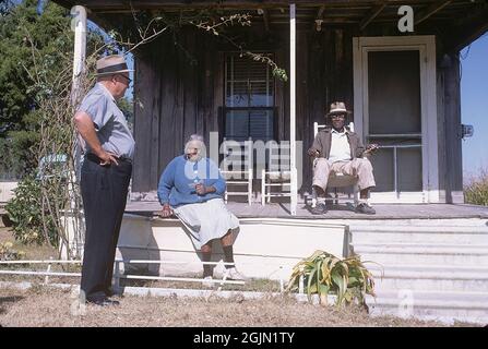 USA Georgia 1967. A cotton farmer with two elderly african american on the porch to their house on the edge on the cottonfields. Kodachrome slide original.   Credit Roland Palm ref 6-4-12 Stock Photo