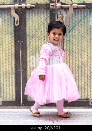 portrait in pink dress of cute indian baby girl. Stock Photo
