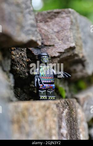 GREENVILLE, UNITED STATES - Aug 16, 2021: A closeup of a Lego minifugue of the Black Panther on the rock Stock Photo