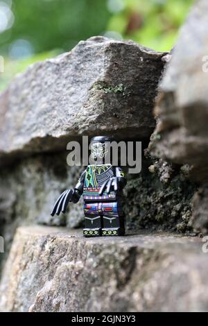 GREENVILLE, UNITED STATES - Aug 16, 2021: A closeup of a Lego minifugue of the Black Panther on the rock Stock Photo