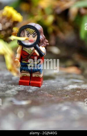 GREENVILLE, UNITED STATES - Aug 16, 2021: A closeup Lego minifigure of the Wonder Woman on a rocky surface Stock Photo