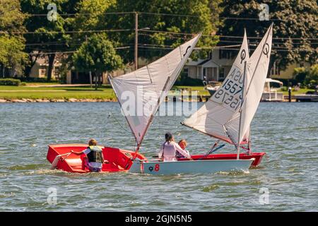 The sail training foundation holds youth sail training classes Fridays from May through October, in the channel between Lake Michigan and Green Bay. Stock Photo