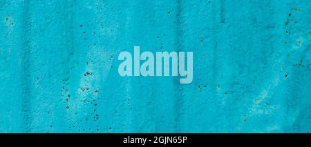 Cracked painted old metal texture. Abstract background of painted turquoise surface. Grunge blue wall background Stock Photo