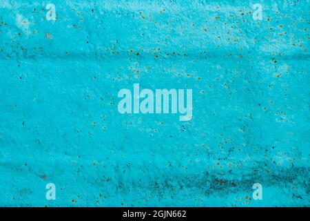 Cracked painted old metal texture. Abstract background of painted turquoise surface. Grunge blue wall background Stock Photo