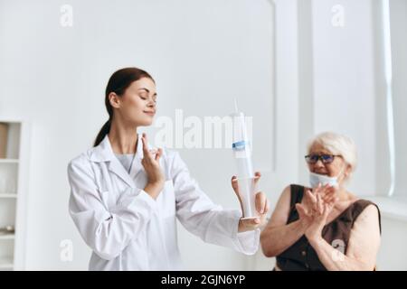 emotional elderly woman hand injection vaccine passport Stock Photo