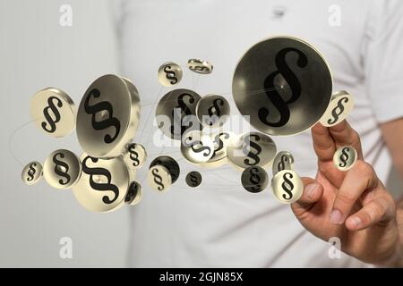 Shot of fingers touching a virtual 3d modeling of law and justice conceptual symbols on white desks Stock Photo