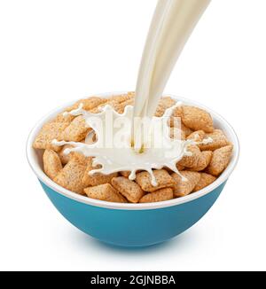 Corn pads with pouring milk isolated on white background Stock Photo