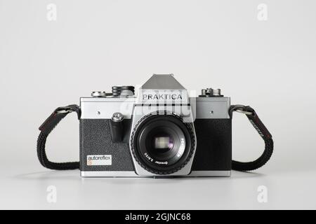 Izmir, Turkey - March 09, 2021: Izmir, Turkey. Front view of a Black and gray colored Praktica Analog camera with a Pentacon f2.8/5.0 lens on a white Stock Photo