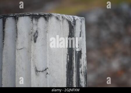 Ancient Doric order marble fragment at the sanctuary of Athena Pronaia the sacred archaeological site in Delphi, Phocis Greece. Stock Photo