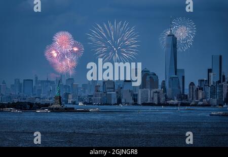 Statue of Liberty and Freedom Tower During Fireworks Stock Photo