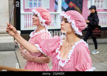 London, UK. 11th September 2021. Ocean Rebellion a sister group to Extinction Rebellion stage a theatrical action outside Selfridges in Oxford Street to protest the use of Oxybenzone in sun screen products.   Credit: Joao Daniel Pereira Credit: Joao Daniel Pereira/Alamy Live News