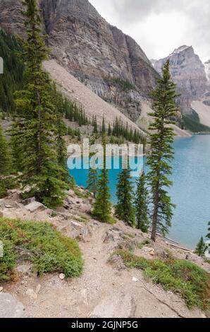 Moraine Lake in cloudy day in summer in Banff National Park, Alberta, Canada Stock Photo