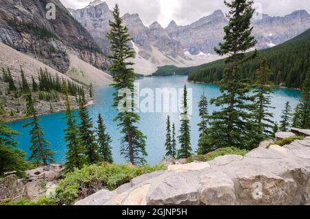 Moraine Lake in cloudy day in summer in Banff National Park, Alberta, Canada Stock Photo