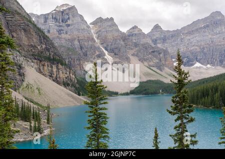 Moraine Lake in cloudy day in summer in Banff National Park, Alberta, Canada Stock Photo