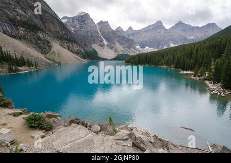 Moraine Lake in cloudy day in summer in Banff National Park, Alberta, Canada Stock Photo