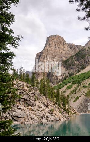 Moraine Lake in cloudy day in summer in Banff National Park, Alberta, Canada Stock Photo