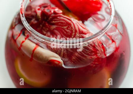 Punch prepared for Halloween party with decorative elements stylized as human organs, scary drink Stock Photo