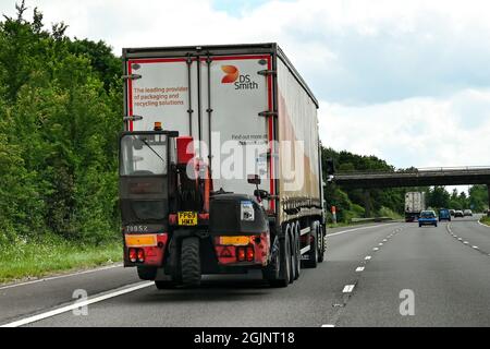 Swindon, England - June 2021: Articulated lorry carrying its own fork lift truck for unloading Stock Photo