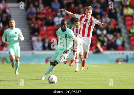 Stoke On Trent, UK. 11th Sep, 2021. Mouhamadou-Naby Sarr of Huddersfield Town (23) gets away from Sam Clucas of Stoke City. EFL Skybet Championship match, Stoke City v Huddersfield Town at the Bet365 Stadium in Stoke on Trent on Saturday 11th September 2021. this image may only be used for Editorial purposes. Editorial use only, license required for commercial use. No use in betting, games or a single club/league/player publications.pic by Chris Stading/Andrew Orchard sports photography/Alamy Live News Credit: Andrew Orchard sports photography/Alamy Live News Stock Photo