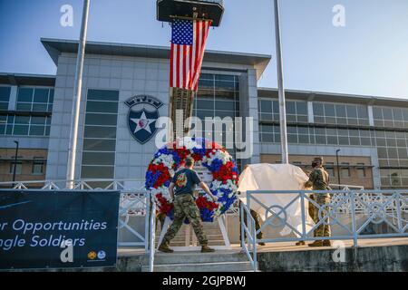 Pyeongtaek, South Korea. 11th Sep, 2021. U.S. Army Maj. Gen. Dave Lesperance, right, commanding general of 2nd Infantry Division, and Col. Seth C. Graves, left, the commander of Army Garrison Humphreys, unveil a ceremonial wreath during a remembrance event on the 20th anniversary of the 9/11 terrorist attacks at Camp Humphreys September 11, 2021 in Pyeongtaek, South Korea. The event commemorates the nearly 3,000 people killed by terrorists on September 11th, 2001. Credit: Spc. Matthew Marcellus/U.S. Army/Alamy Live News Stock Photo