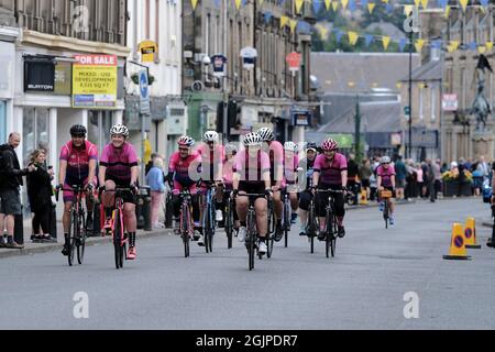 Hawick, UK. 11th Sep, 2021. AJ Bell Tour of Britain 2021 - Stage Seven - Hawick to Edinburgh. Motorcycle outriders lead local cycling club members ahead of the departing competitors Credit: Rob Gray/Alamy Live News Stock Photo