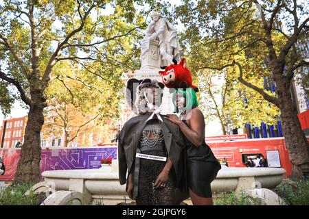 London, UK. 11th Sep, 2021. The models pose with the Shakespeare statue on Leicester Square. Models pose in extravagant outfits and accessories at a flashmob street fashion show for designer Pierre Garroudi in the streets of central London. Credit: Imageplotter/Alamy Live News Stock Photo